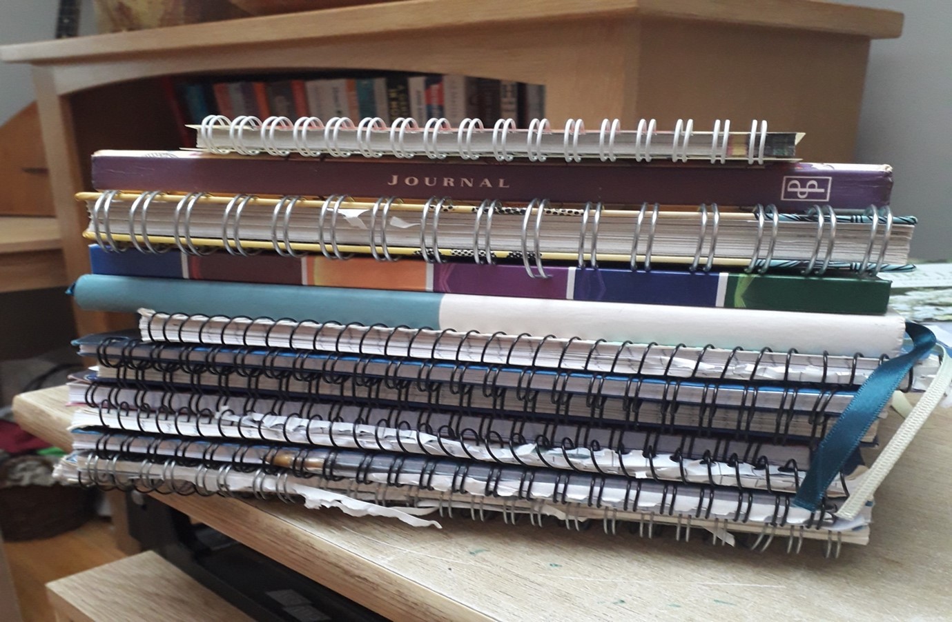 a pile of used notebooks