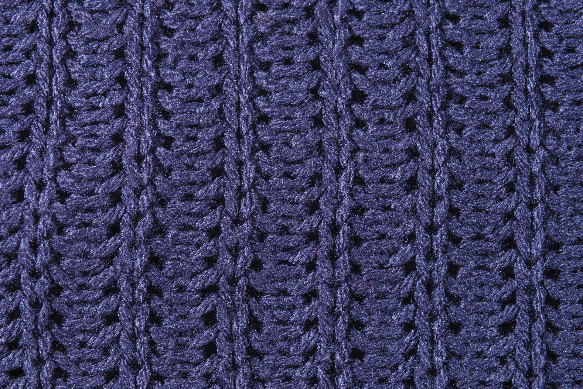 zoomed in photo of purple knitted fabric