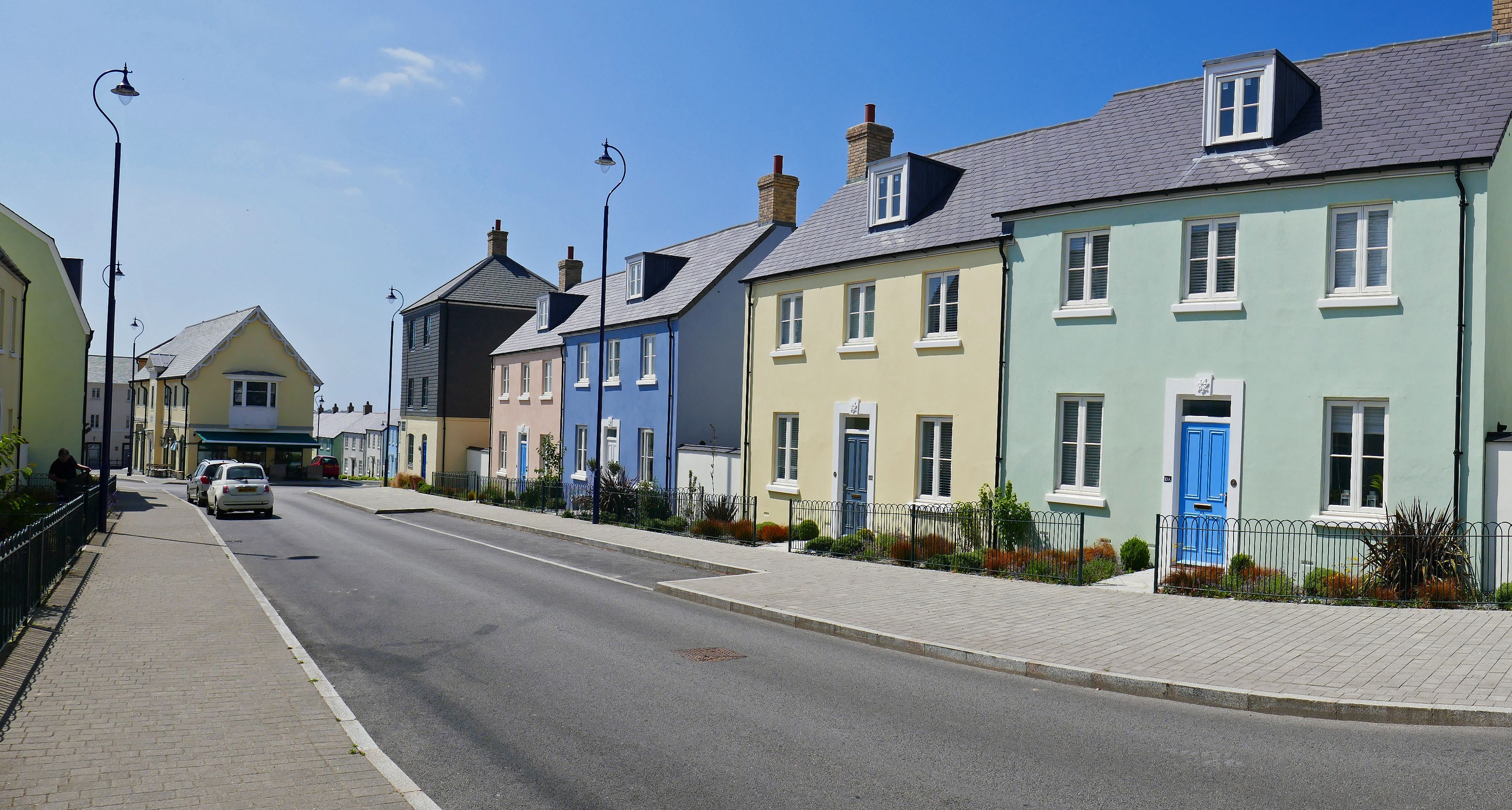 a row of colourful houses with blue sky 