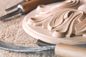 An image of a woodwork piece of art, and tools of the trade