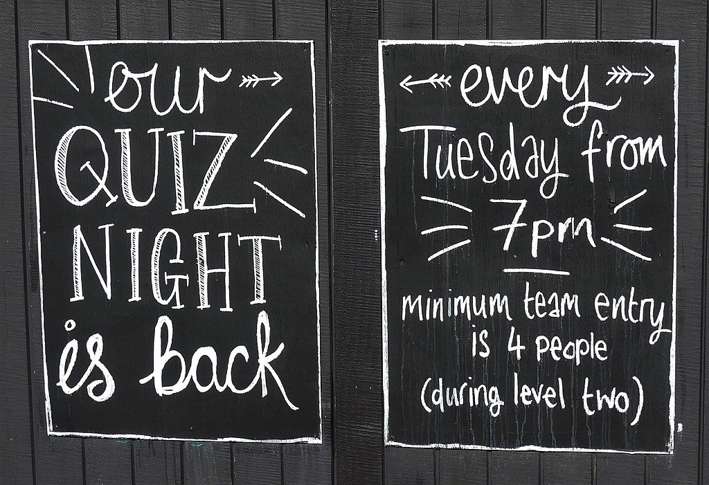 chalkboard advertising a pub quiz every tuesday at 7pm