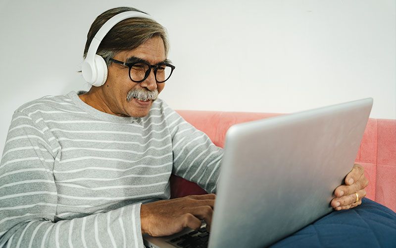 Man using a mobile phone to contact family