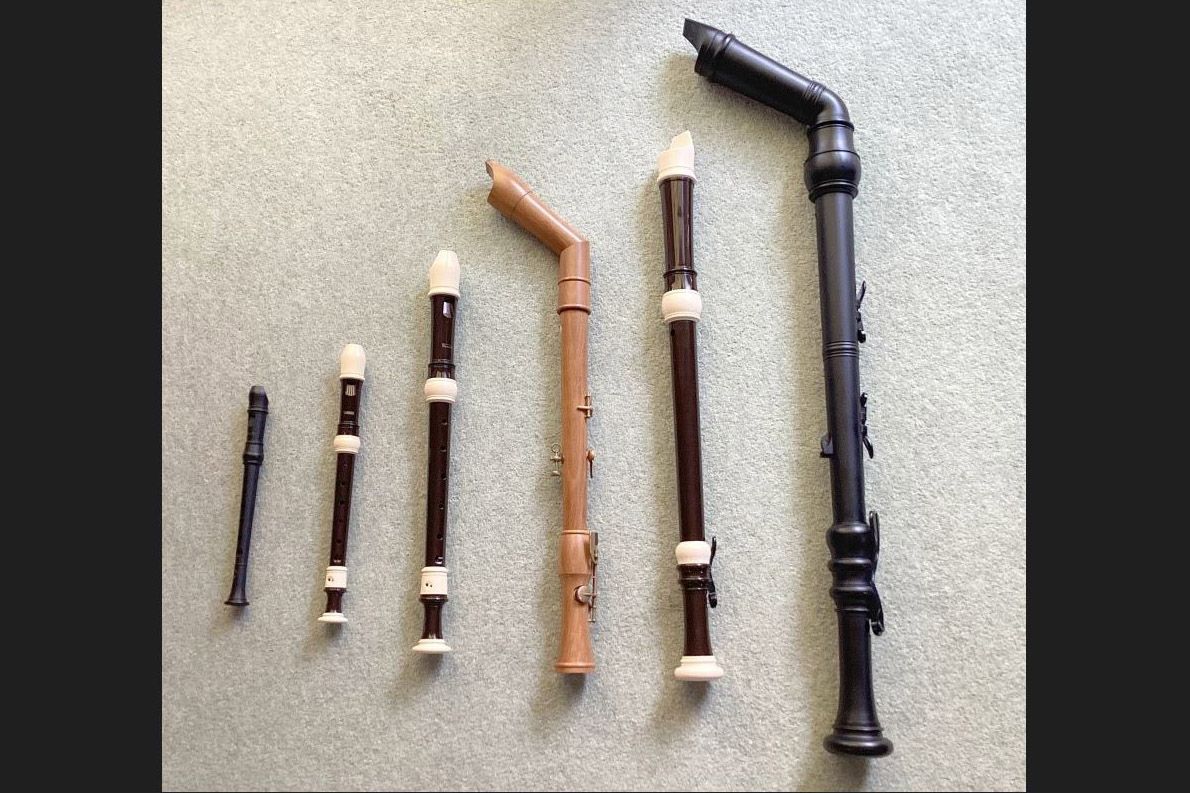 a photo of 5 recorders laid out on the floor