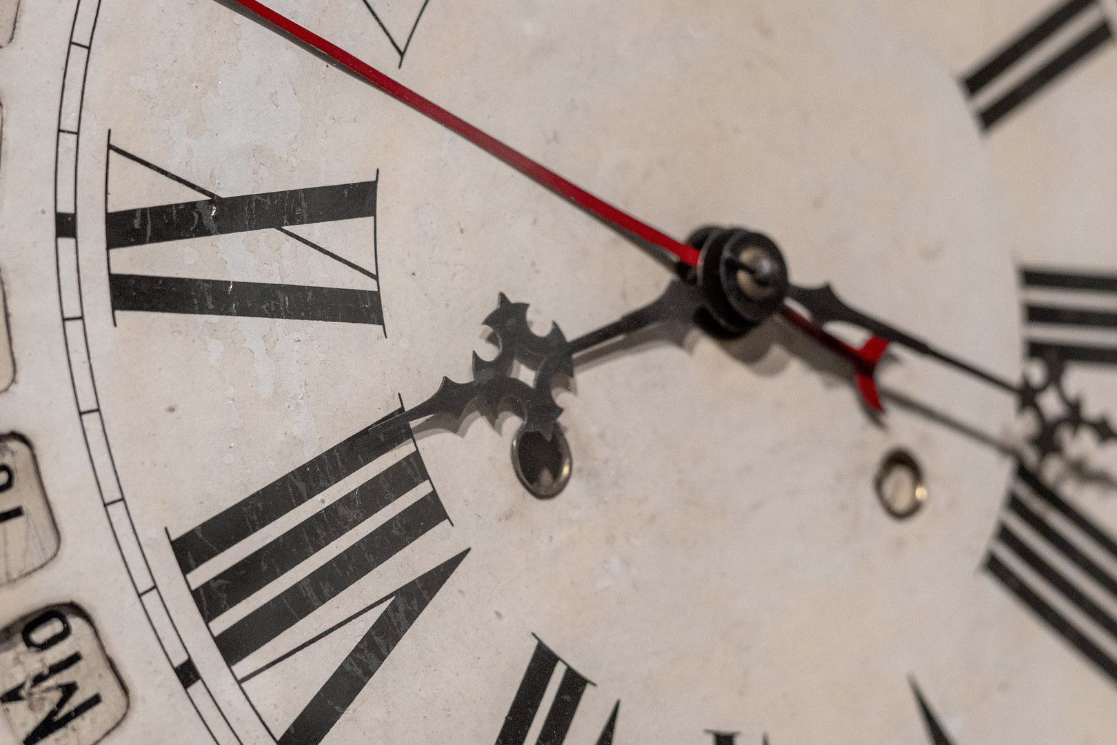 a zoom in of a grandfather clock clock face