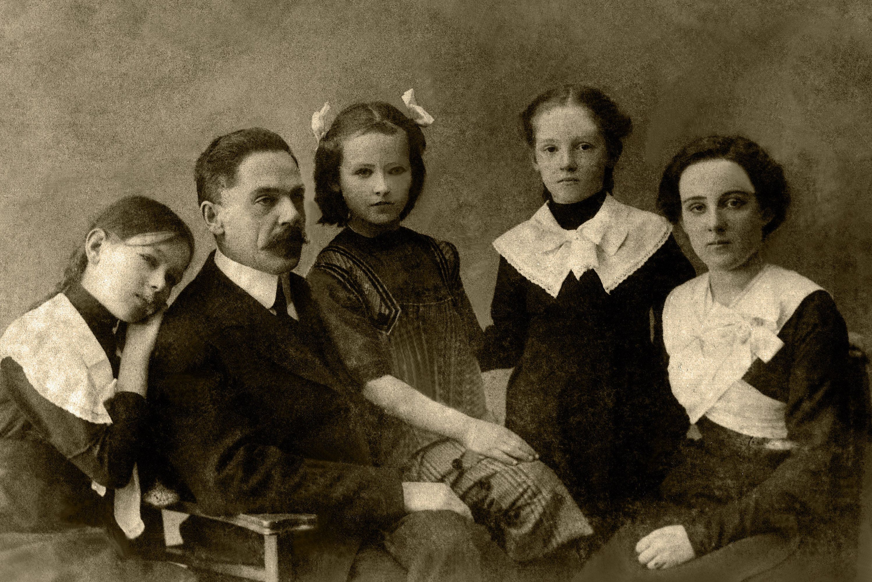 a black and white photo of a family 